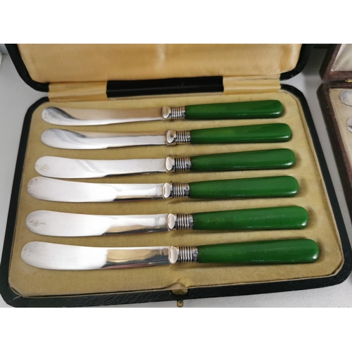 342 - Two cased green handled butter knife set one with hall marked silver collars and a cased set of spoo... 