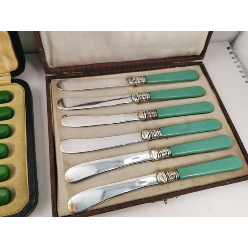 342 - Two cased green handled butter knife set one with hall marked silver collars and a cased set of spoo... 