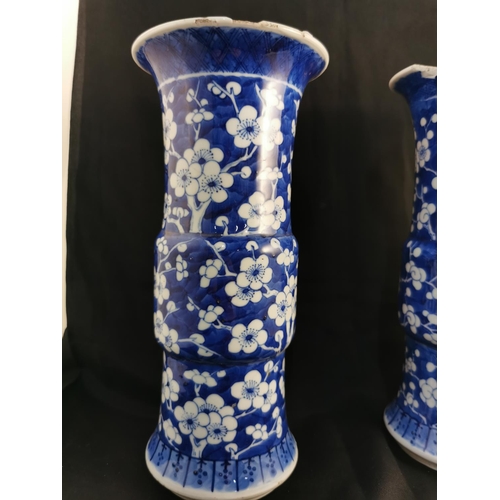 370 - A pair of Antique Chinese Blue & White apple blossom vases with Kangxi reign mark to base 
25.5 cm t... 