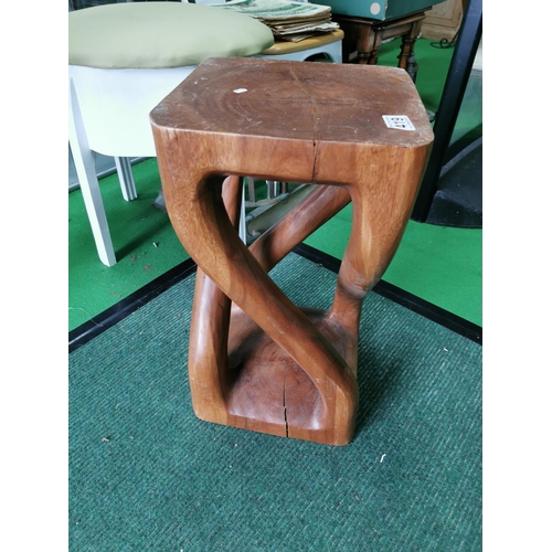 419 - Unusual stool carved out of one piece of wood 51cm high 28cm wide