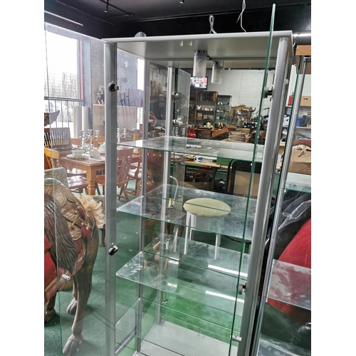 428 - Glass two door display cabinet with built in light and four glass shelves, mirrored back, height 168... 