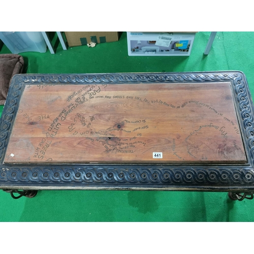 441 - Vintage ornate wrought iron based table with solid oak inset carved with poems on trees 121cm long, ... 