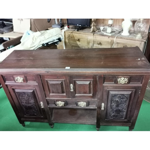 442 - Ornate Victorian solid mahogany side board with two good carved doors and brass fittings, drawers an... 