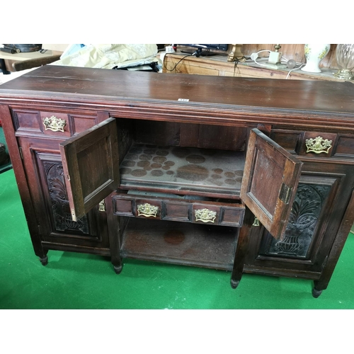 442 - Ornate Victorian solid mahogany side board with two good carved doors and brass fittings, drawers an... 