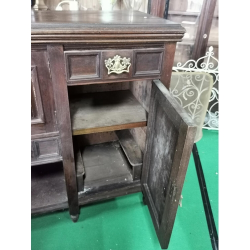 442 - Ornate Victorian solid mahogany side board with two good carved doors and brass fittings, drawers an... 