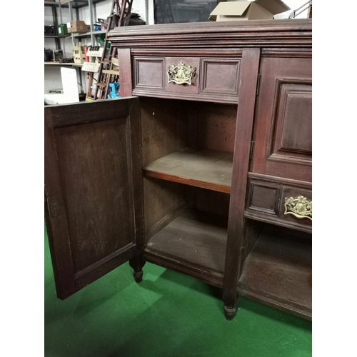 442 - Ornate Victorian solid mahogany side board with two good carved doors and brass fittings, drawers an... 