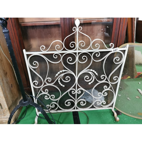 447 - Wrought iron cream painted fire screen and one other, width of iron one is 64cm with a height of 72c... 