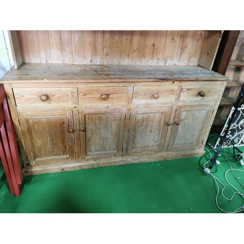 450 - Good antique pitch pine dresser with four drawers and four doors below, with nice galleried shelf wi... 