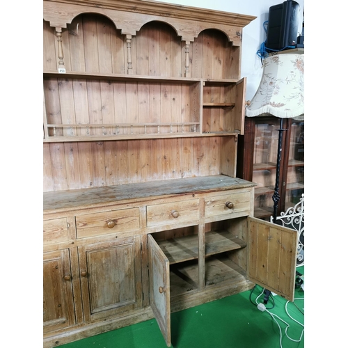 450 - Good antique pitch pine dresser with four drawers and four doors below, with nice galleried shelf wi... 