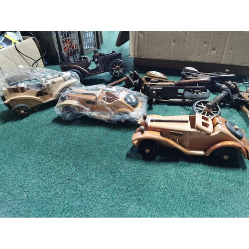 468 - Very large quantity various wooden model cars and motorcycles along with a box of parts most have bi... 