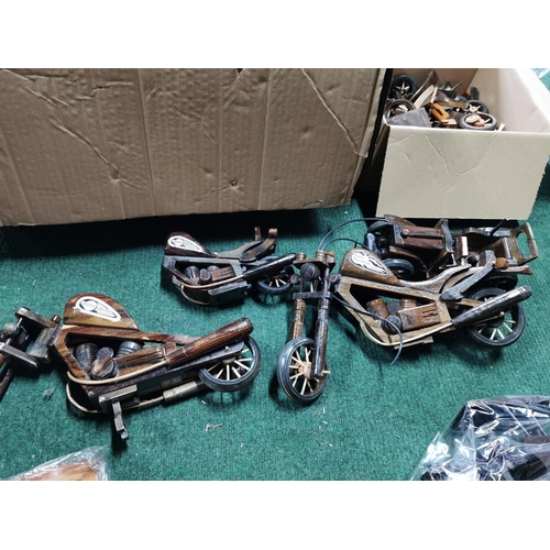 468 - Very large quantity various wooden model cars and motorcycles along with a box of parts most have bi... 