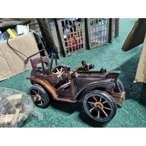 468 - Very large quantity various wooden model cars and motorcycles along with a box of parts most have bi... 