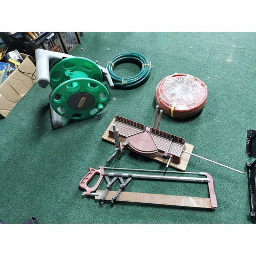 485 - Two hose pipes hose lock reel and mitre saw