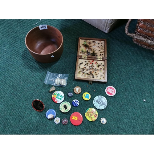 109 - Quantity of vintage badges inc Guinness badges a wooden bottle and a case of vintage flies