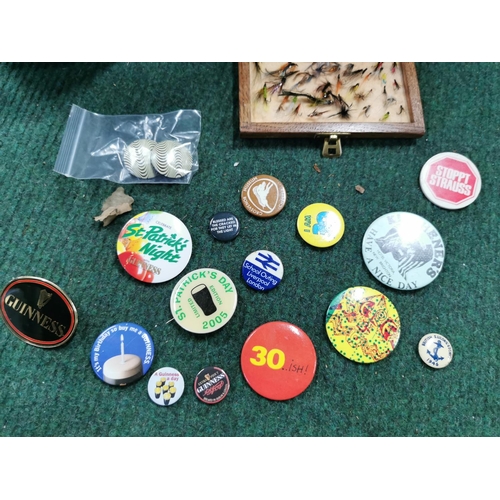 109 - Quantity of vintage badges inc Guinness badges a wooden bottle and a case of vintage flies