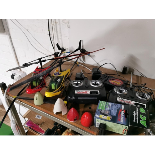 112 - Two stunt radio controlled helicopters with two controllers two chargers etc