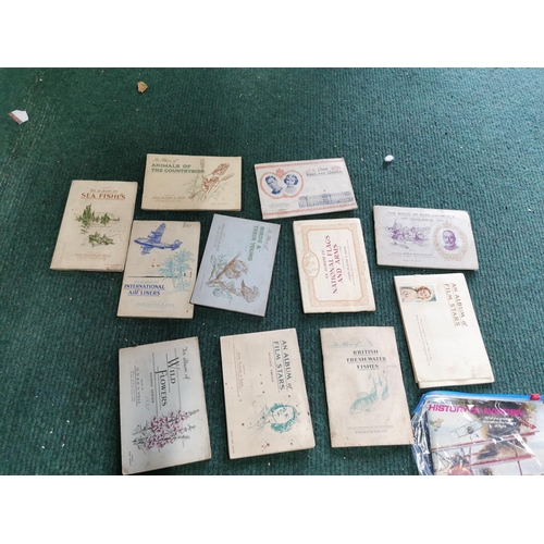 137 - Large quantity of cigarette / tea card albums all mostly complete plus a quantity of clocking in car... 