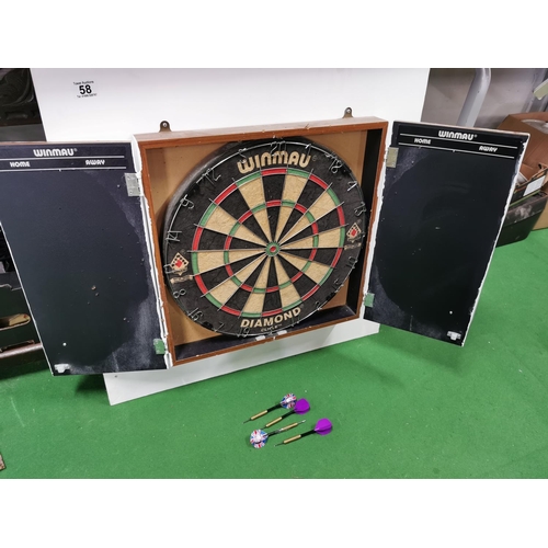 58 - Cased Winmau dartboard with a set of darts