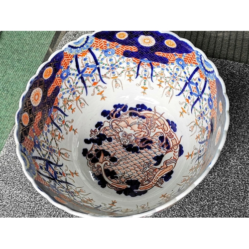 157 - Antique large hand painted Japanese scallop rimmed Imari fish bowl with a dragon to the center insid... 