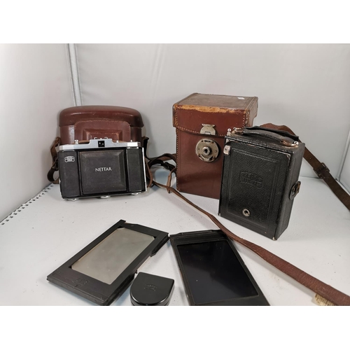 101 - Vintage Zeiss Ikon Compur plate camera with its original case and extra plates along with a Zeiss Ik... 