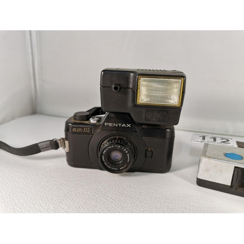 112 - Miniature Pentax auto 110 with a 24mm lens with a Pentax AF 100 P flash, with two Kodak Instamatic 2... 