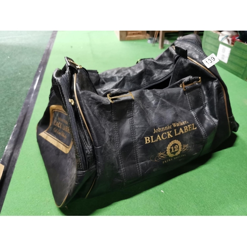 139 - Vintage leather Johnny Walker Black Label bag containing a quantity of kids toys