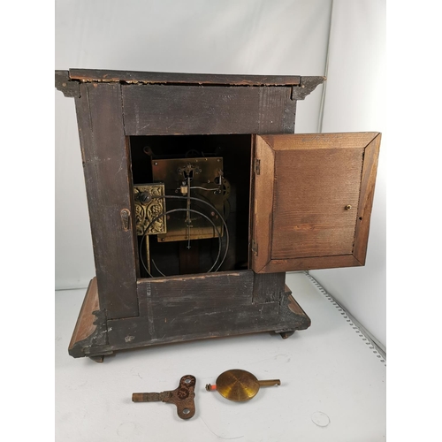 166 - Vintage oak mantle clock with brass dial with key and pendulum, 33cm high, 31cm wide, 18cm deep