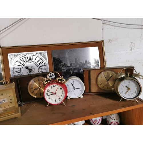 186 - Job lot of clocks 9 in total inc an Enfield oak mantle clock and two Metamec clocks