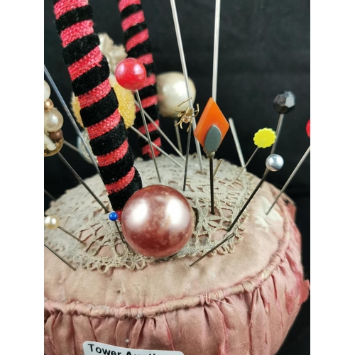 227 - Large Victorian pin cushion containing a large quantity of various types of hat pins
