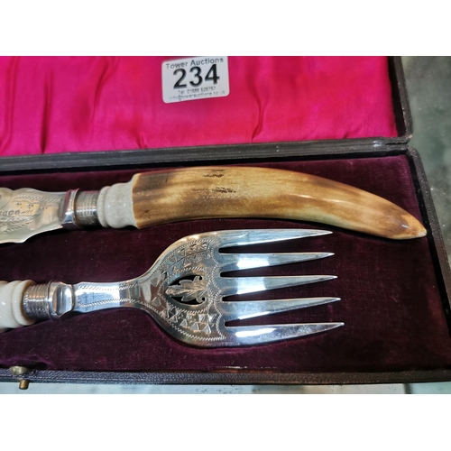 234 - Nice quality serving set with horn handles and hallmarked silver collars in a fitted plush case