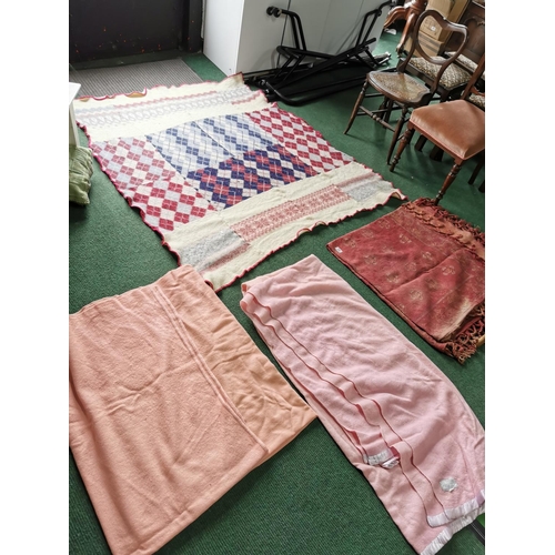 29 - Two pink woollen blankets a Victorian red table cloth and a handmade woollen blanket which has a few... 