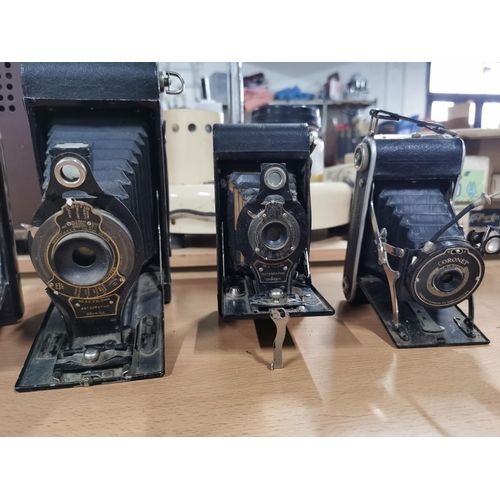 60 - Quantity of four vintage folding cameras, three with their original cases