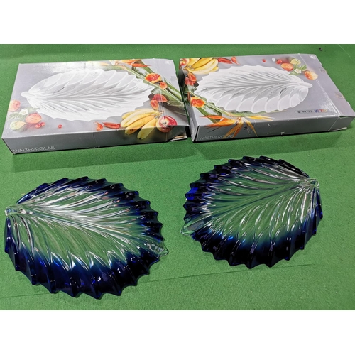 67 - Pair of Walther Glas boxed blue and clear glass crystal leaf formed serving platter, 41cm long