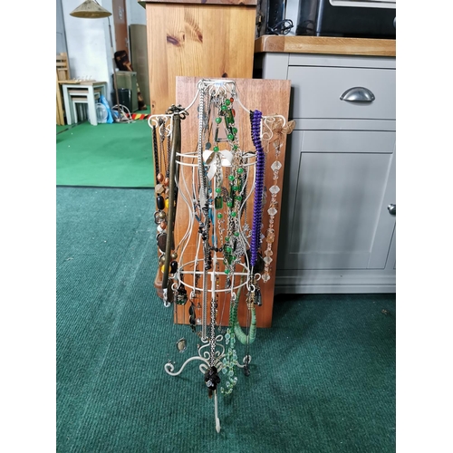 85 - Tall metal jewellery stand draped with costume jewellery 72cm high