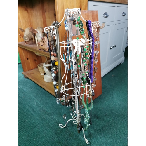 85 - Tall metal jewellery stand draped with costume jewellery 72cm high