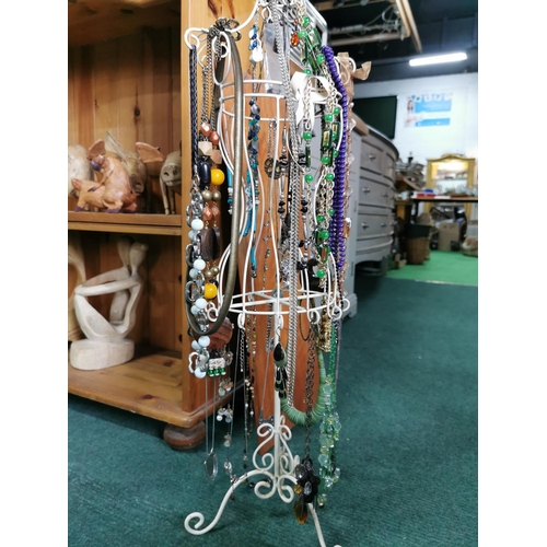 85 - Tall metal jewellery stand draped with costume jewellery 72cm high