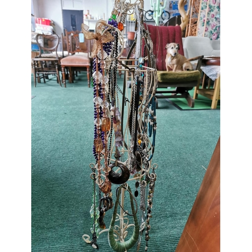 85 - Tall metal jewellery stand draped with costume jewellery 72cm high