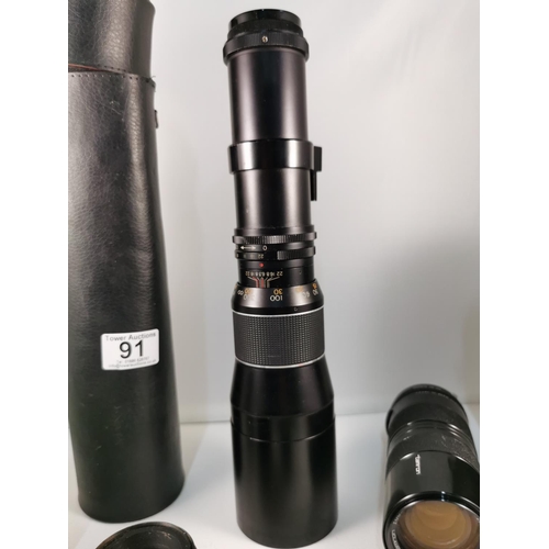 91 - Quantity of camera lenses and camera films inc, a Tamron 85-210mm lens, a Japanese long zoom lens al... 