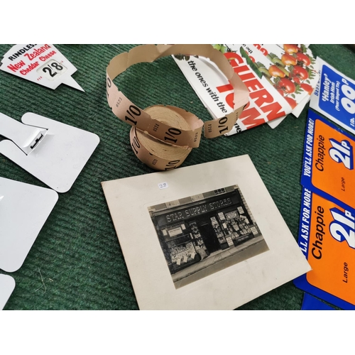 64 - Box full of vintage shop price card tickets along with a large quantity of unused advertising signs ... 