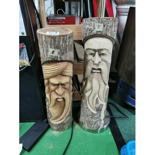 30a - Pair of carved log faces