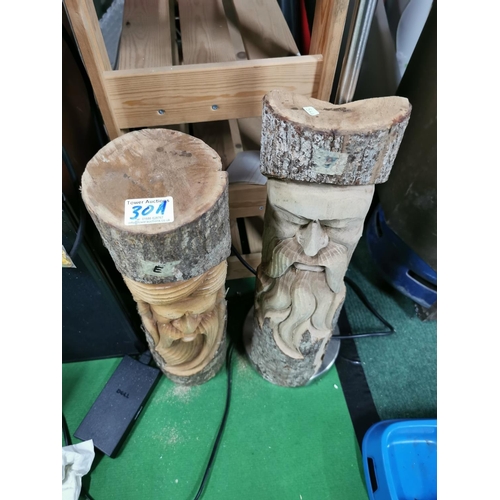 30a - Pair of carved log faces