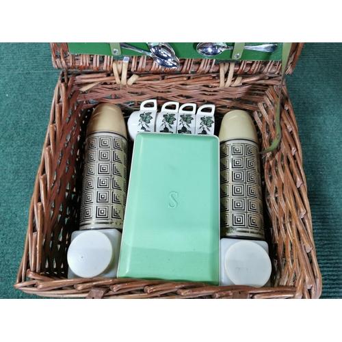 14 - Wicker picnic basket containing  Sirram picnic set inc two thermos flasks cups saucers cutlery etc