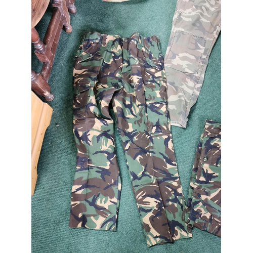 8 - 4 pairs of camouflage combat trousers all size 40w, all in excellent condition