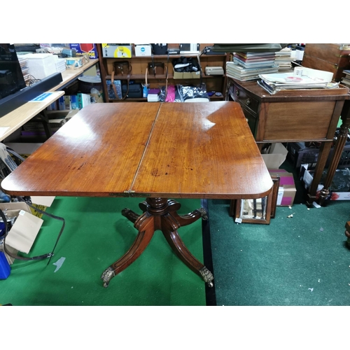 362 - George iii period solid mahogany games table folding top revealing storage under. Pedestal legs bras... 