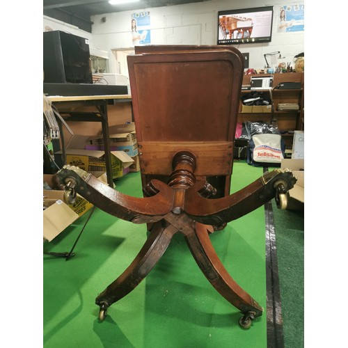 362 - George iii period solid mahogany games table folding top revealing storage under. Pedestal legs bras... 