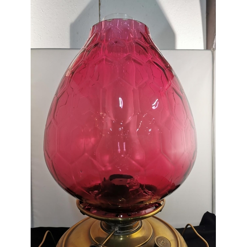 275 - Nice quality Victorian Juno brass oil lamp heater with a very large cranberry glass shade all in goo... 