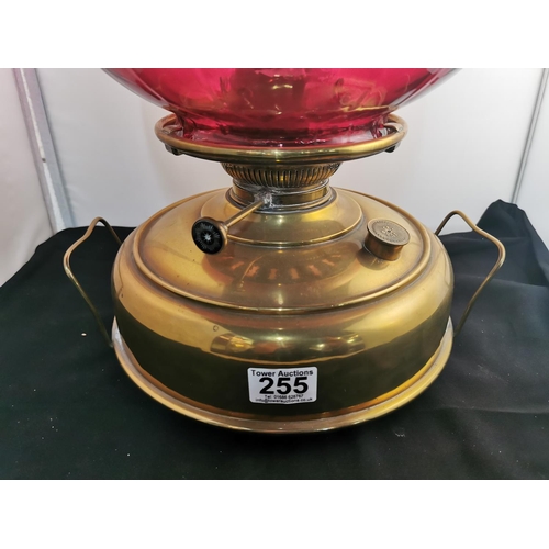 275 - Nice quality Victorian Juno brass oil lamp heater with a very large cranberry glass shade all in goo... 