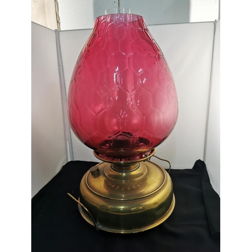 275 - Nice quality Victorian Juno brass oil lamp heater with a very large cranberry glass shade all in goo... 