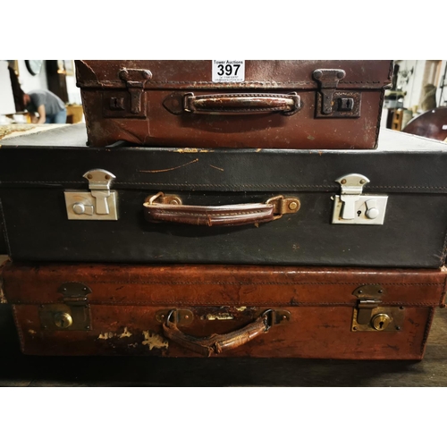 413 - Three vintage suitcases