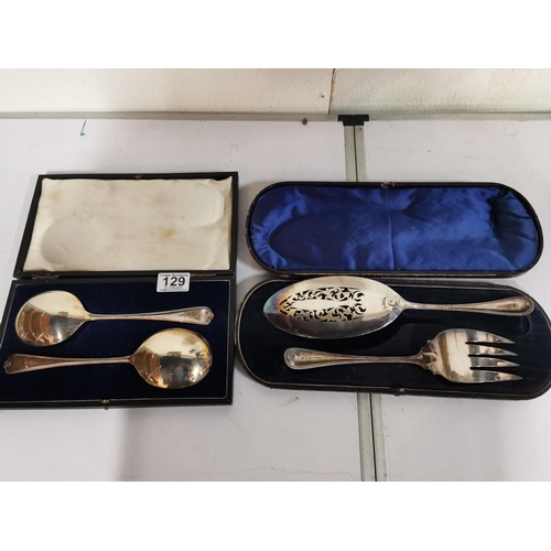 129 - Two cased large serving spoons and a fish serving set